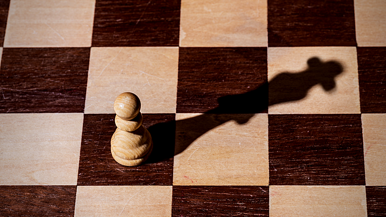 A pawn looks at its shadow and sees a queen