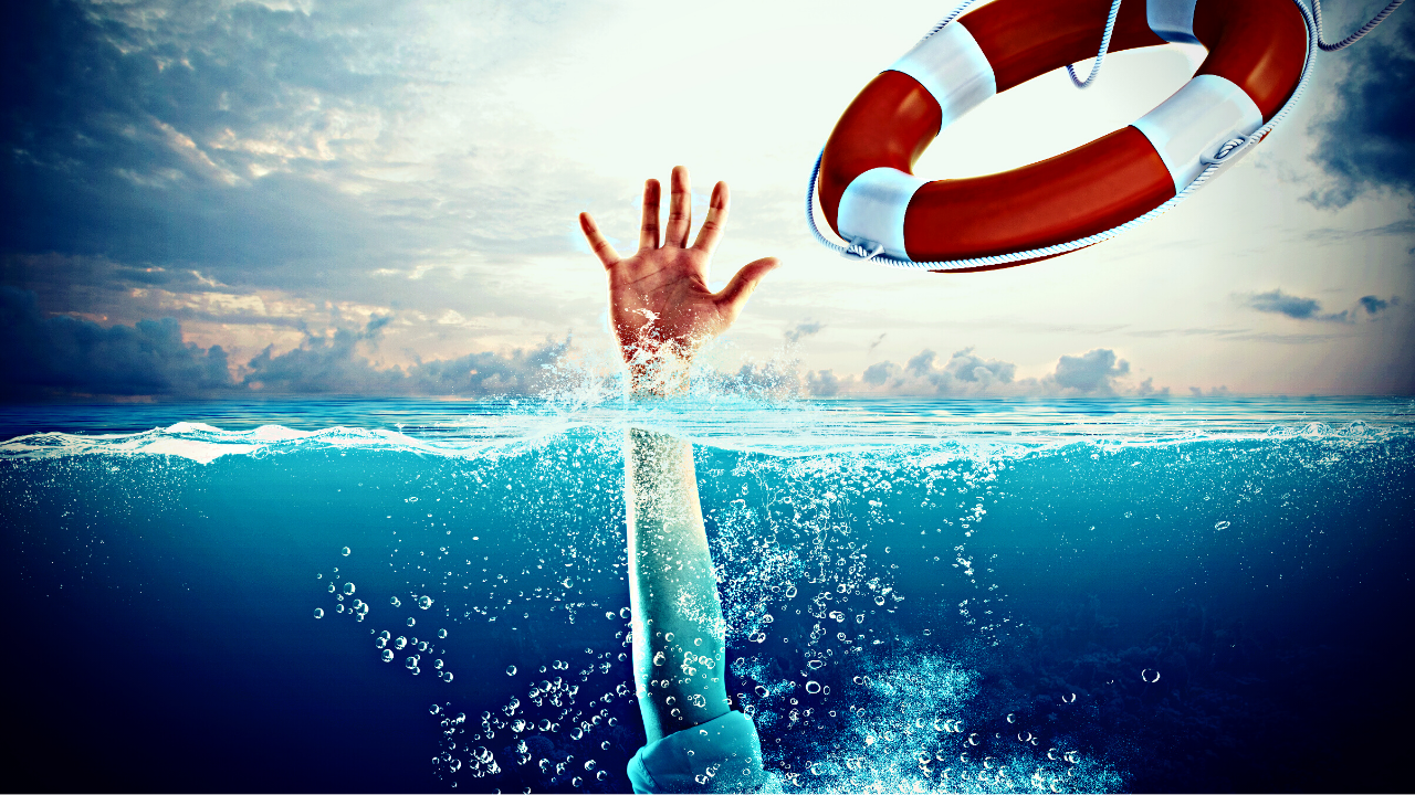 A drowning person is thrown a life preserver.