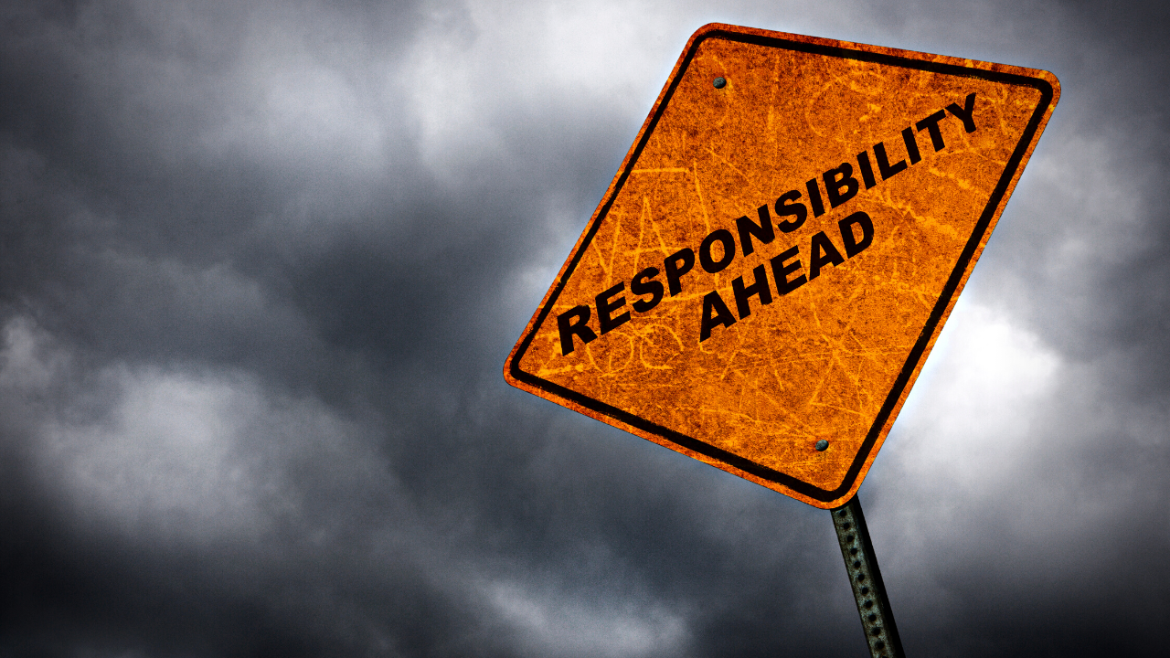 A yellow road sign reads: Responsibility ahead.