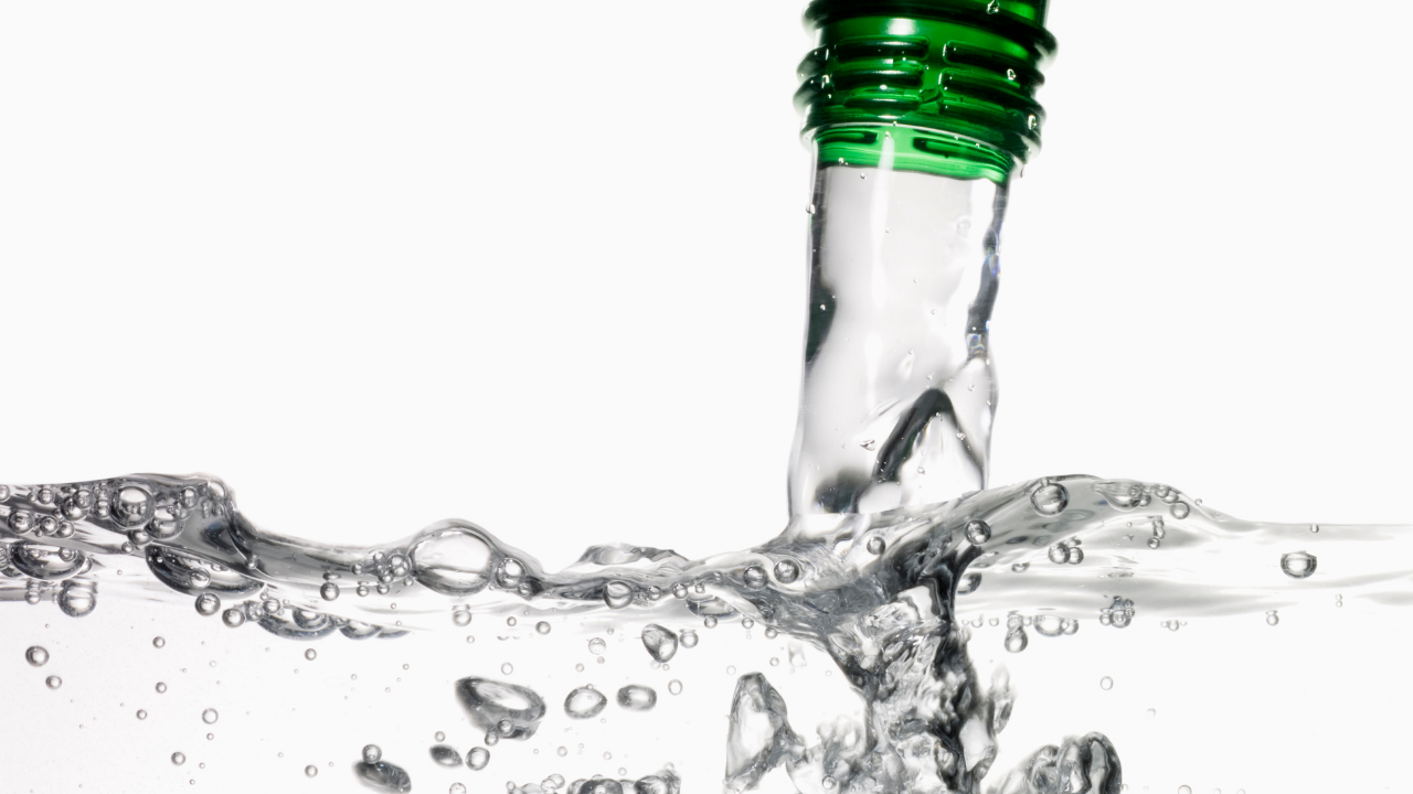 Water pours out of a bottle.