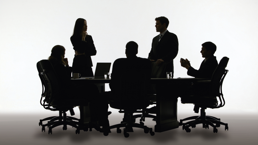 A shadow group attending a business meeting.