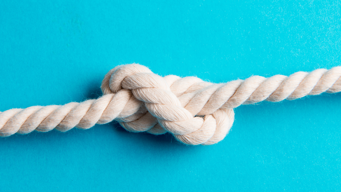 A white knotted rope.